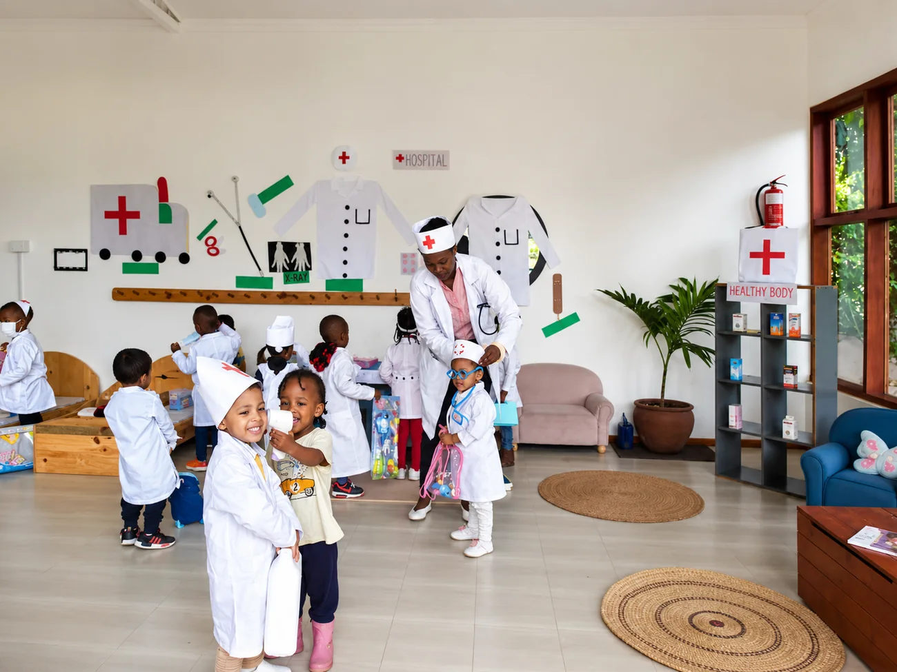 Children playing hospital in the dramatic play area at The Little Nest